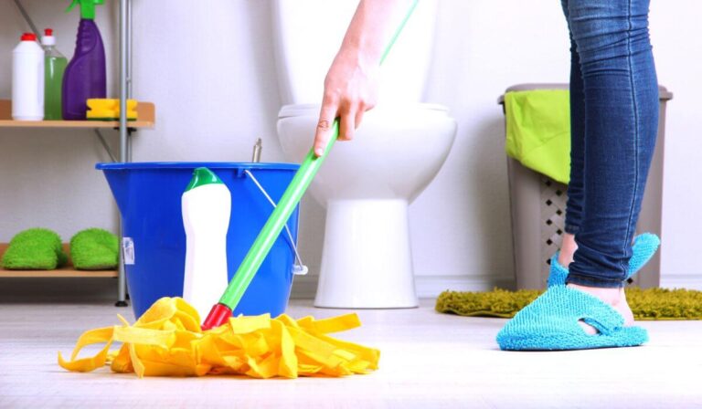 Woman mopping bathroom floor