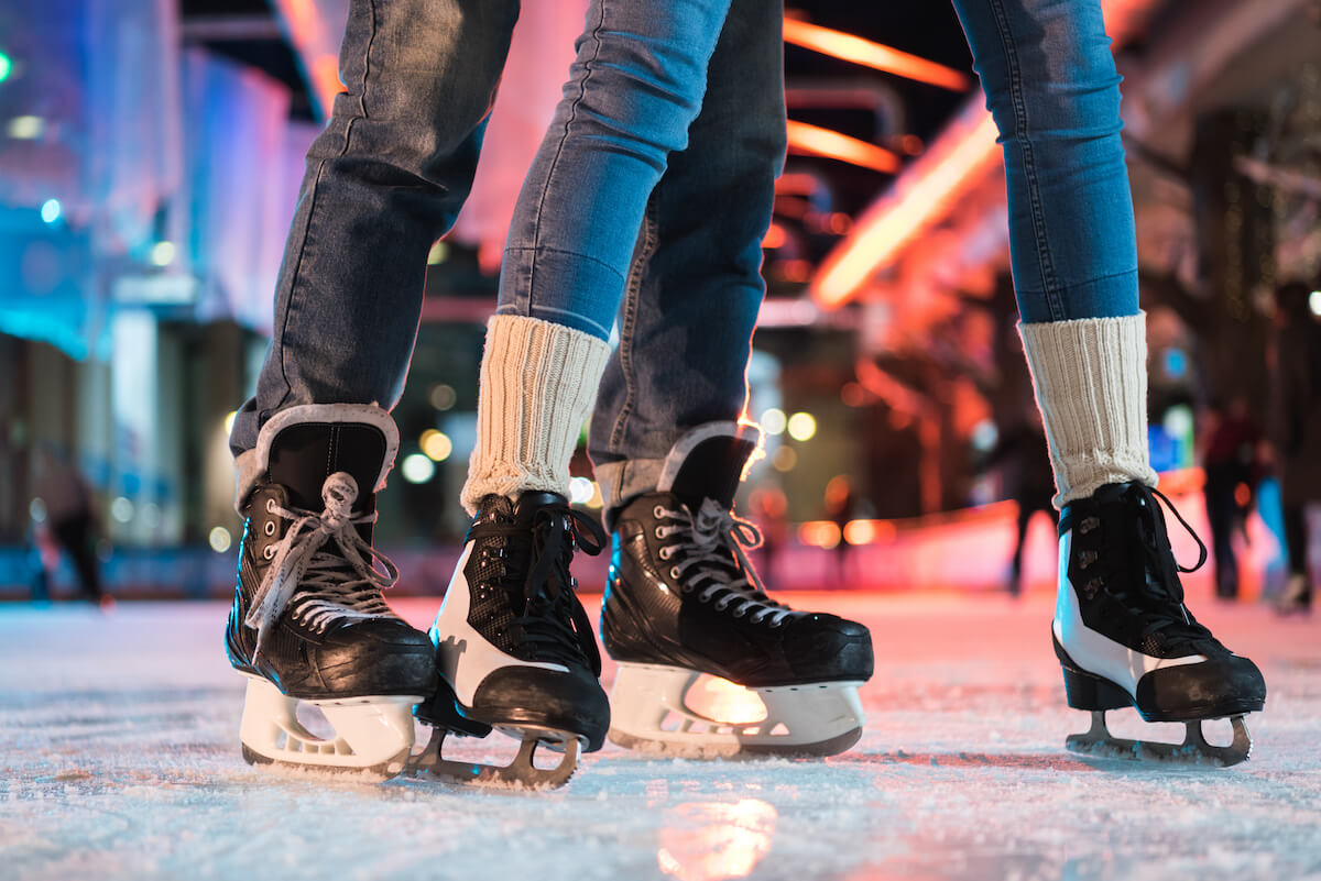 Couple ice skating together