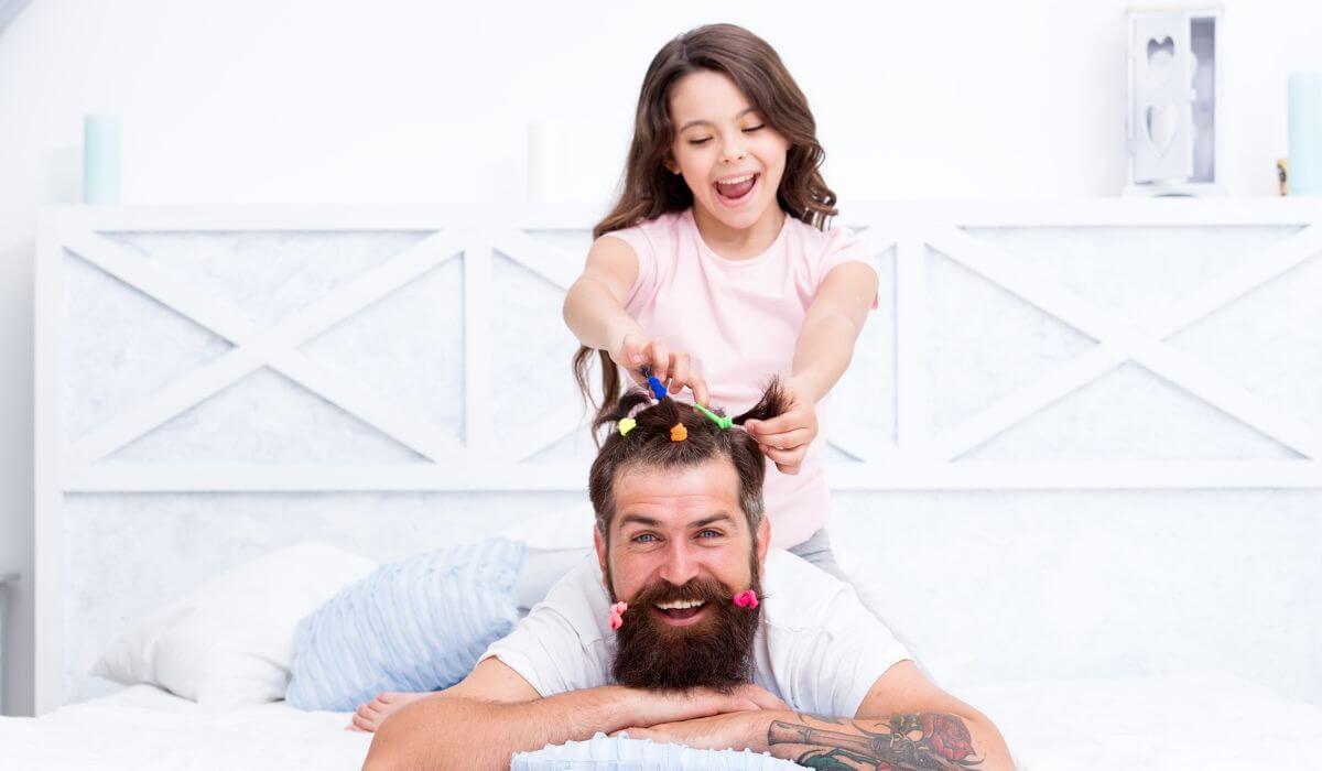 Daughter styling fathers hair