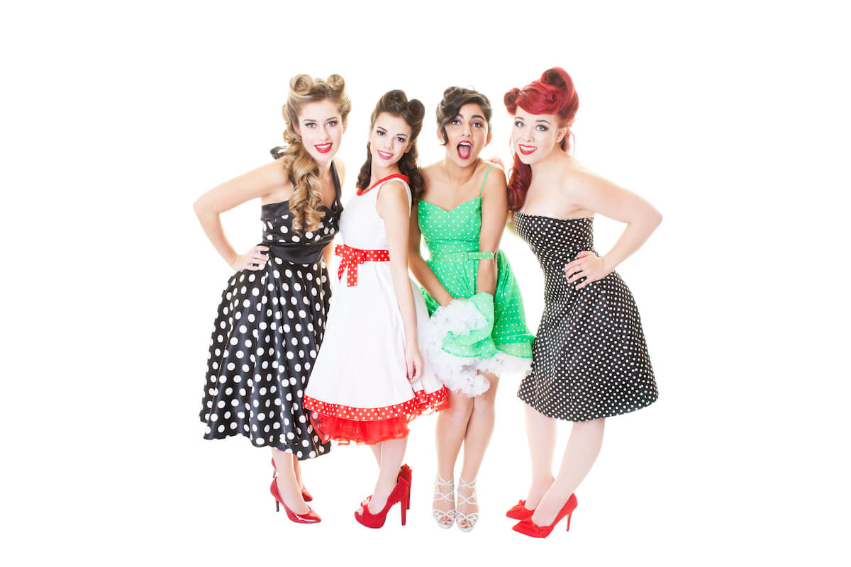 Women at rockabilly 1950s party dress up