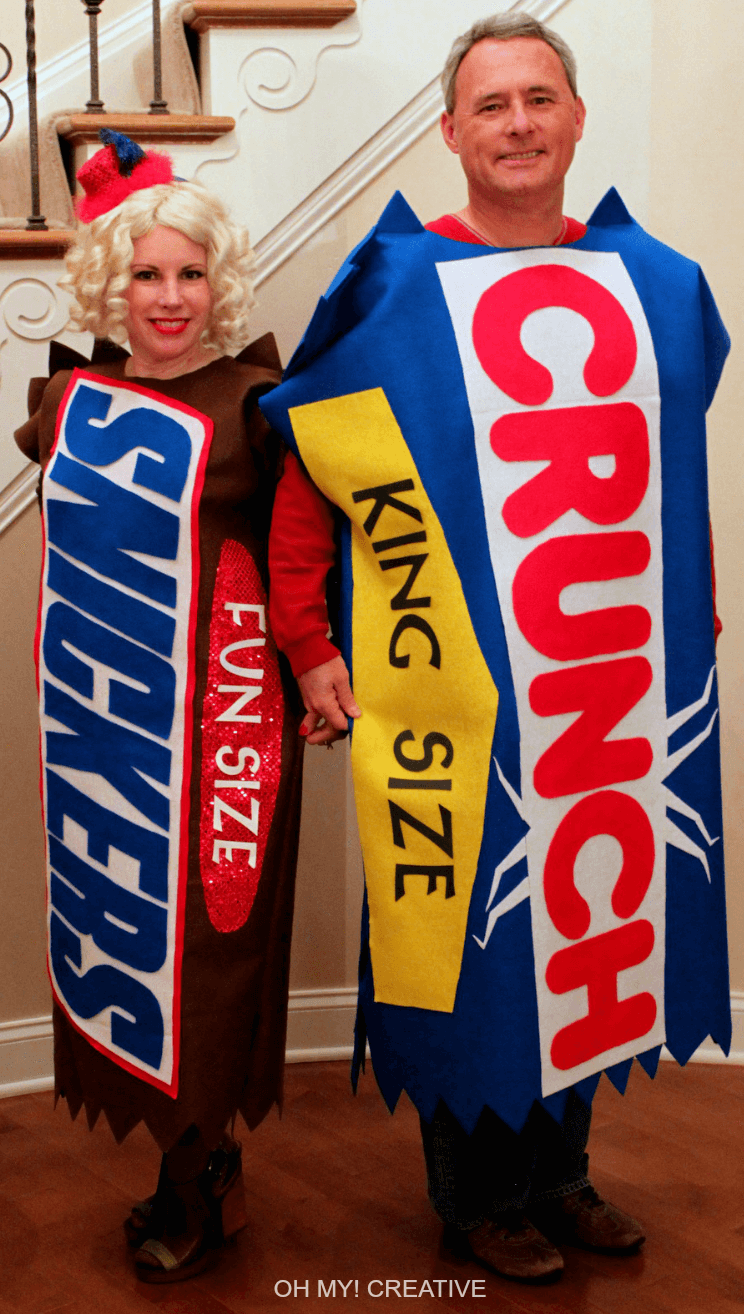 Man and woman dressed as candy bars for halloween with a crunch and snickers bar