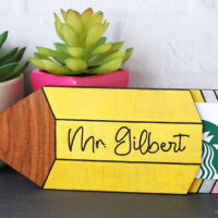 pencil shaped wooden gift card holder that says mrs gilbert on the front