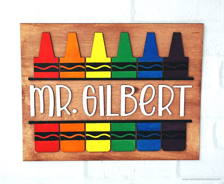 16 Beginner xTool Projects & Laser Cutting Tutorials 14 wooden teacher sign with wooden crayon shapes and mrs gilbert wording