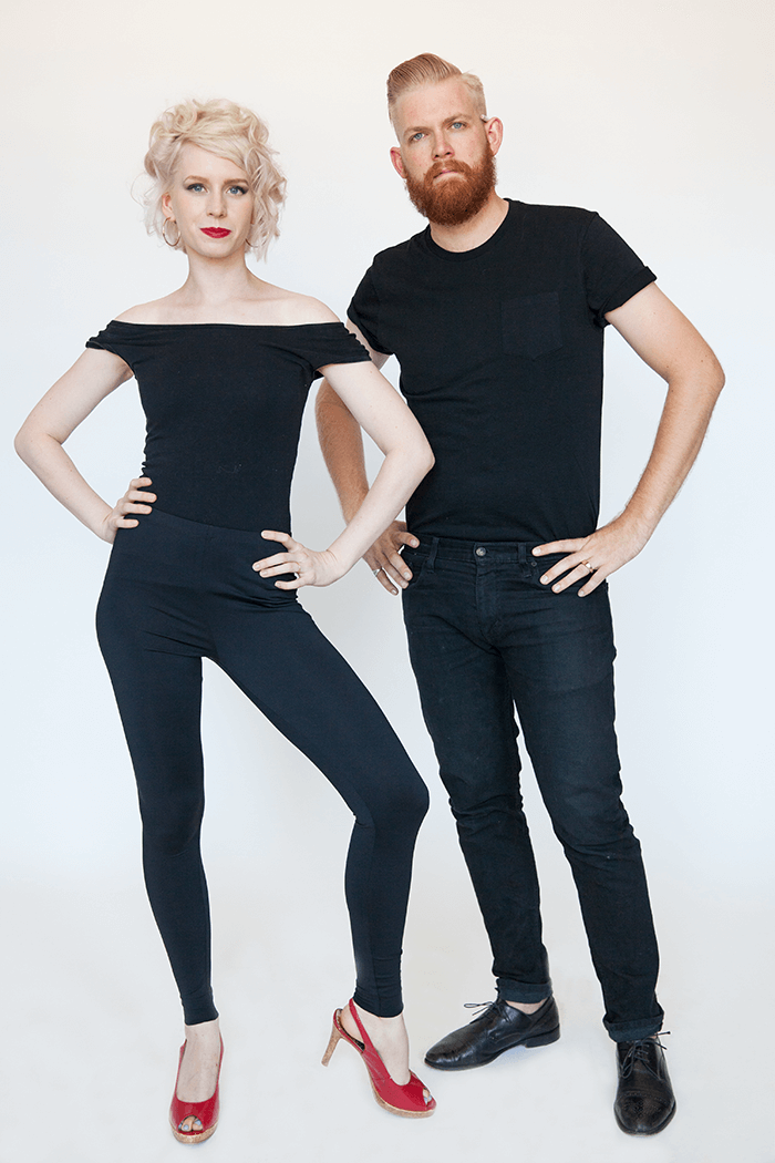 Couple dressed up as sandy and danny from grease for halloween