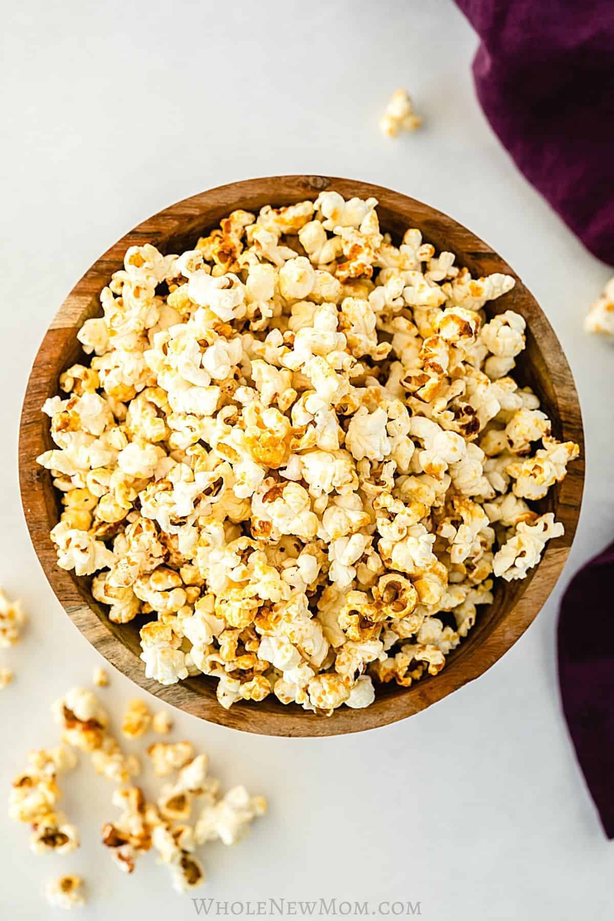 Healthy kettle popcorn spillig out of a brown bowl