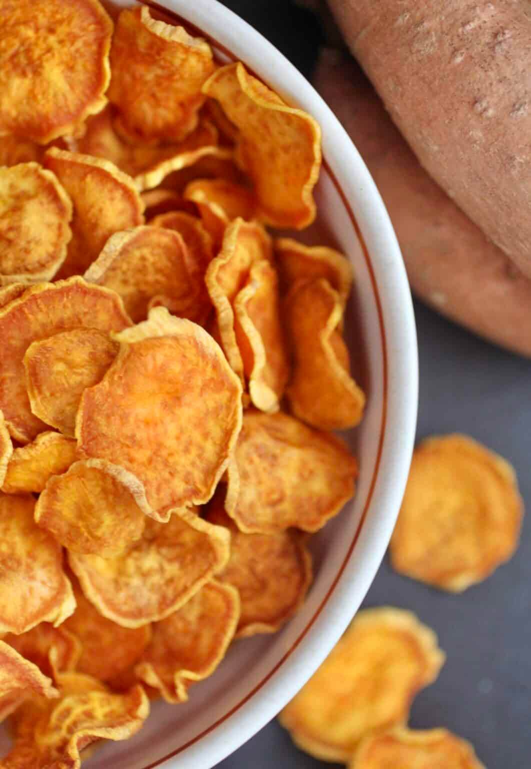 Overflowing bowl of sweet potato chips
