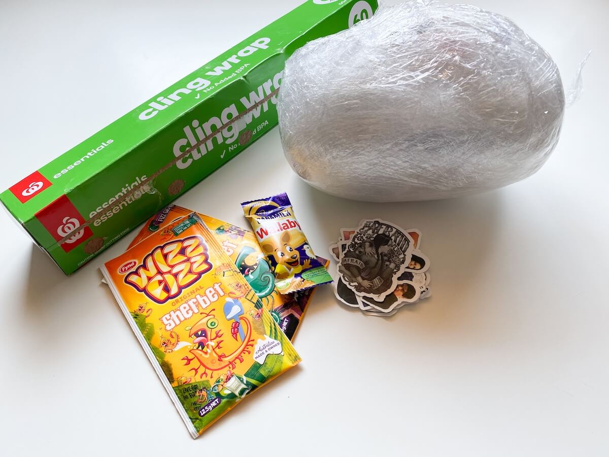 Saran wrap ball game with extra prizes and cling wrap roll.