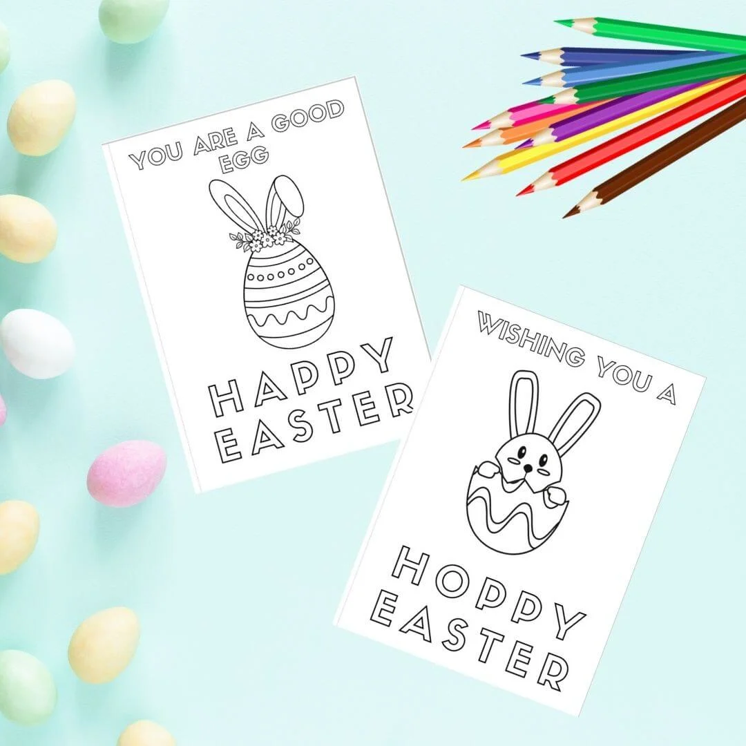 Free printable easter cards on blue background with easter eggs and colouring pencils.