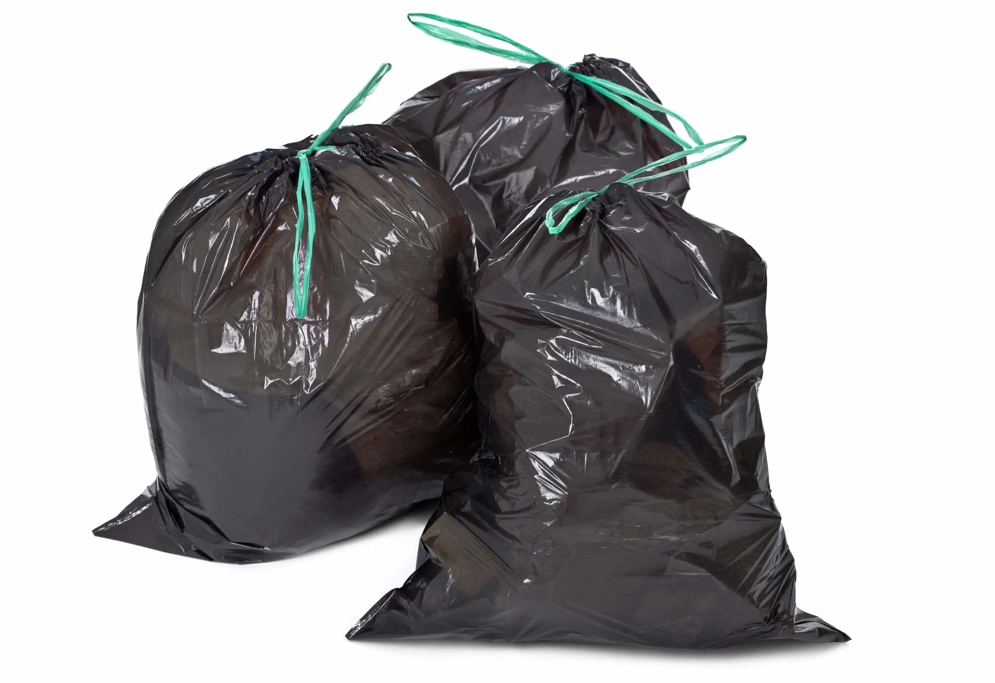 3 full black trash bags with green ties and a white background.