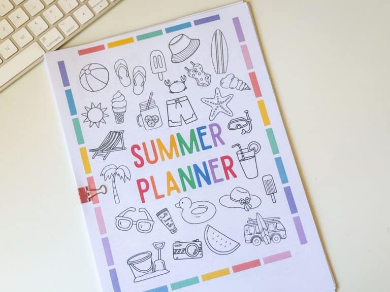 printed summer planner on desk with keyboard.
