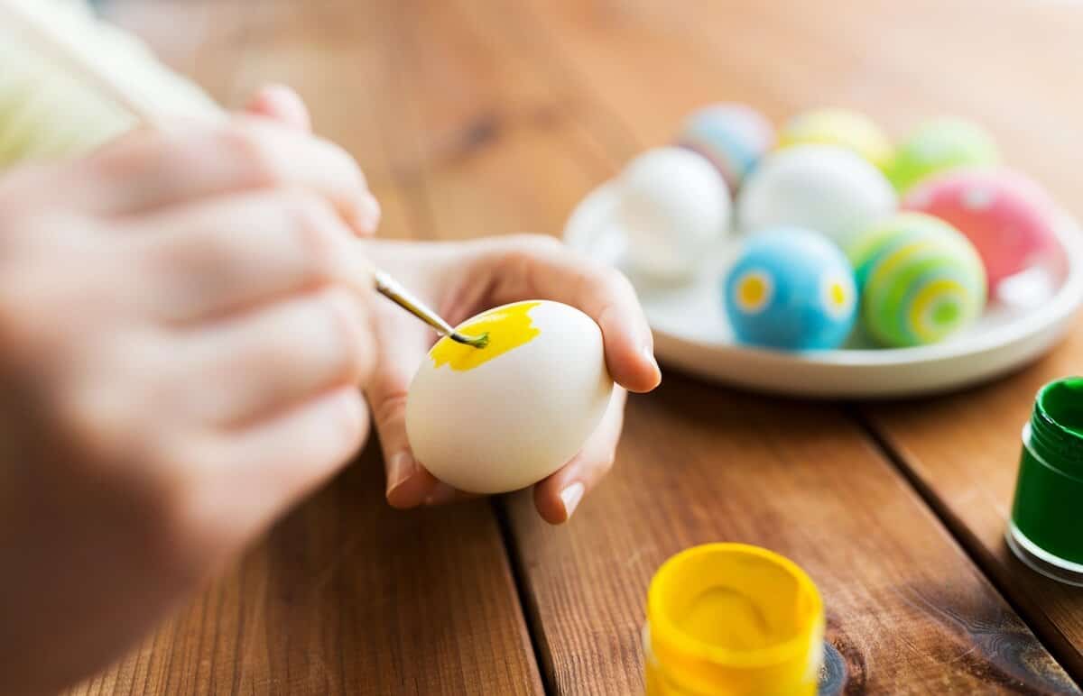 These Easter Party Ideas Are Hoppin' Good Fun! 6 person painting an egg for easter.