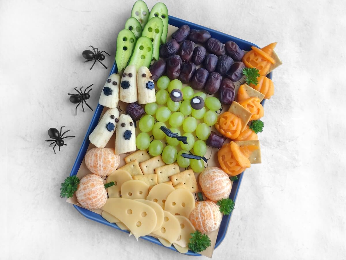 Jack-o’-Lantern Halloween Cheese Shapes 7 frankenstein charcuterie board on white background.