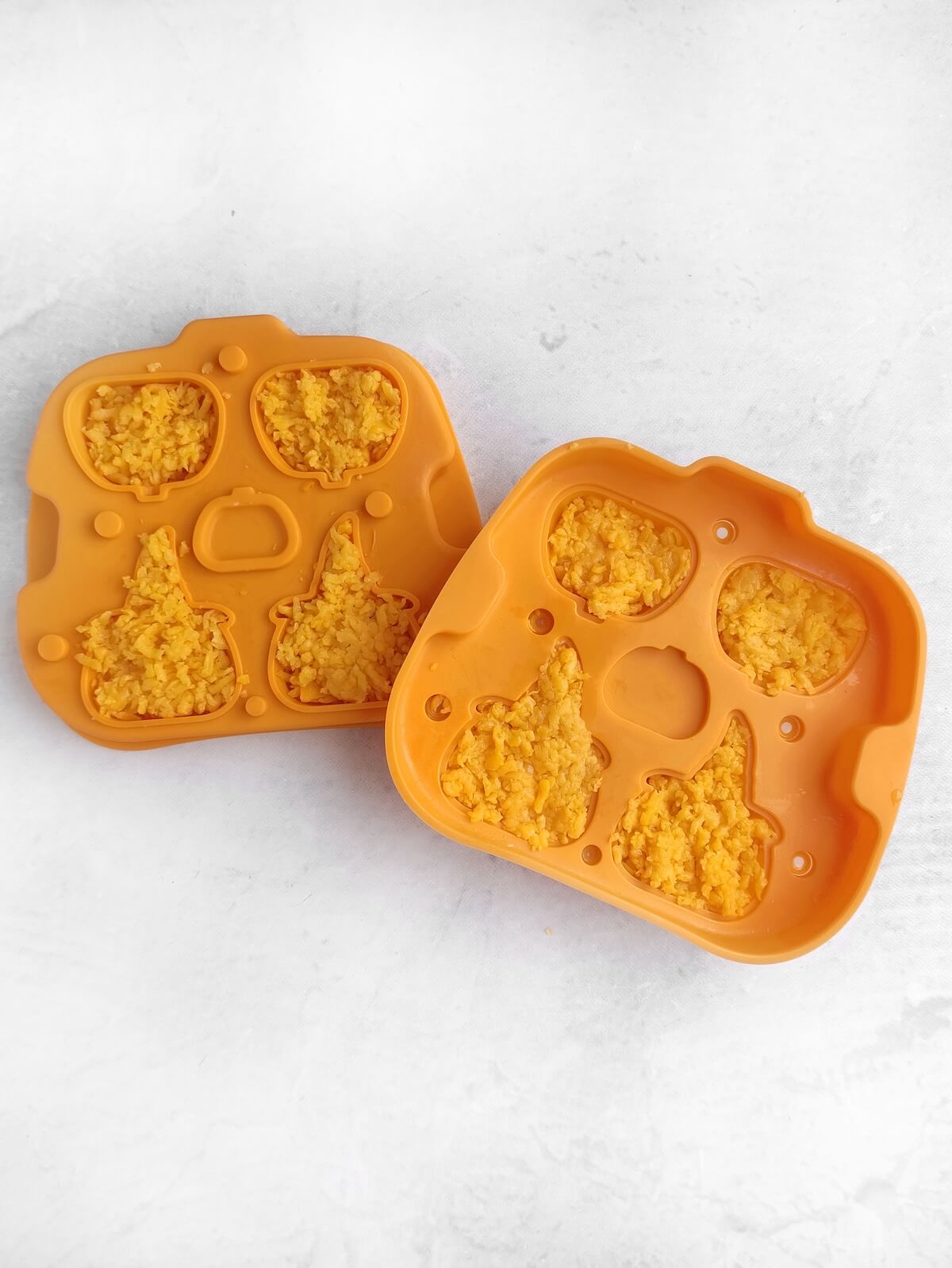 Jack-o’-Lantern Halloween Cheese Shapes 3 shredded cheese in halloween mould.