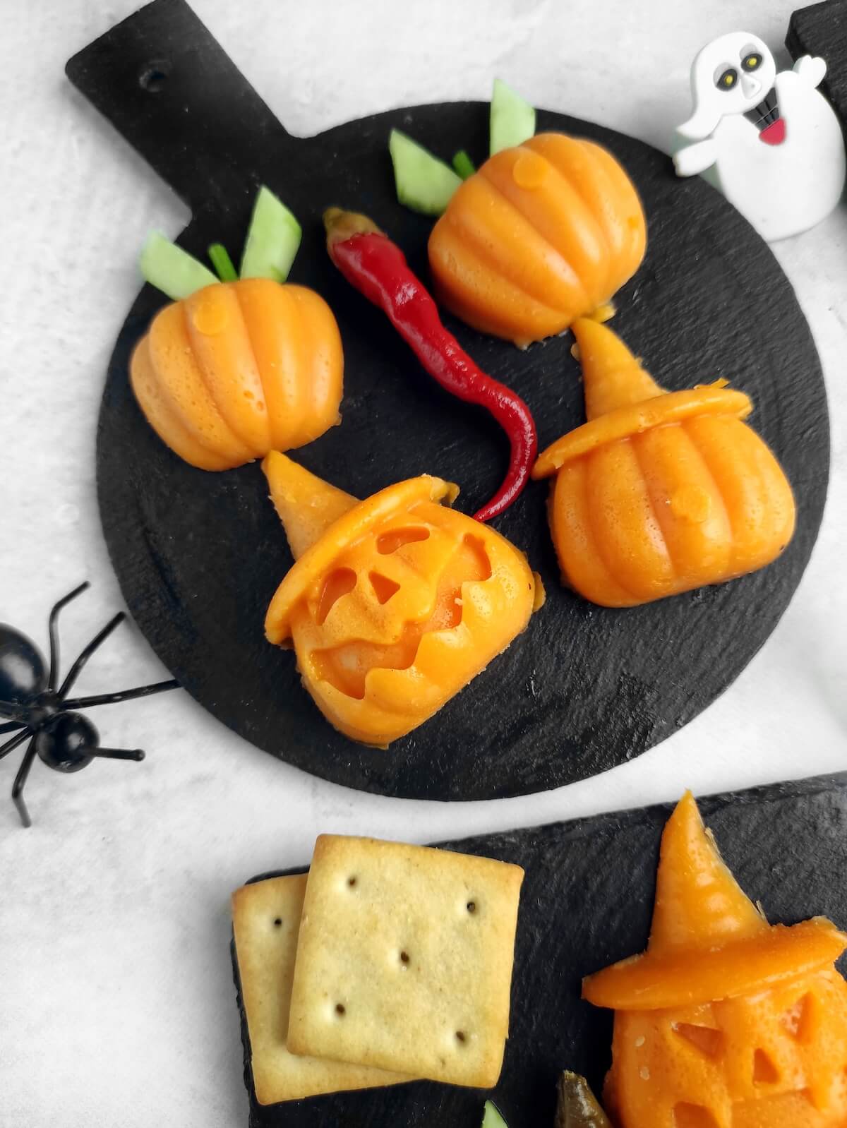 Jack-o’-Lantern Halloween Cheese Shapes 1 jack o lantern halloween cheese shapes on slate boards.