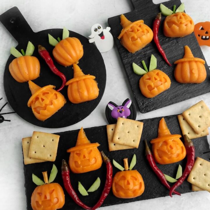 Jack-o’-Lantern Halloween Cheese Shapes 8 jack o lantern halloween cheese shapes on slate boards.
