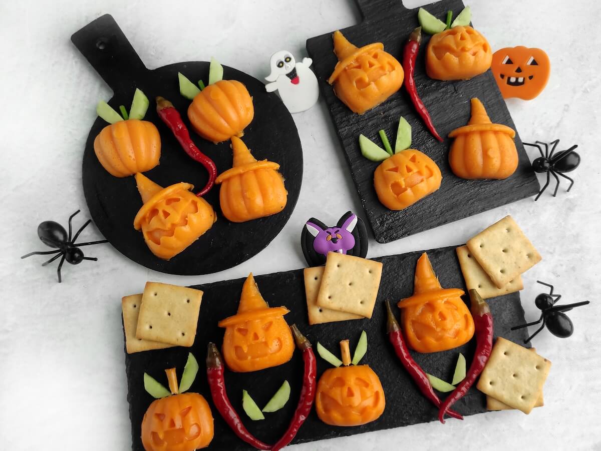 Jack-o’-Lantern Halloween Cheese Shapes 6 jack o lantern halloween cheese shapes on slate boards.