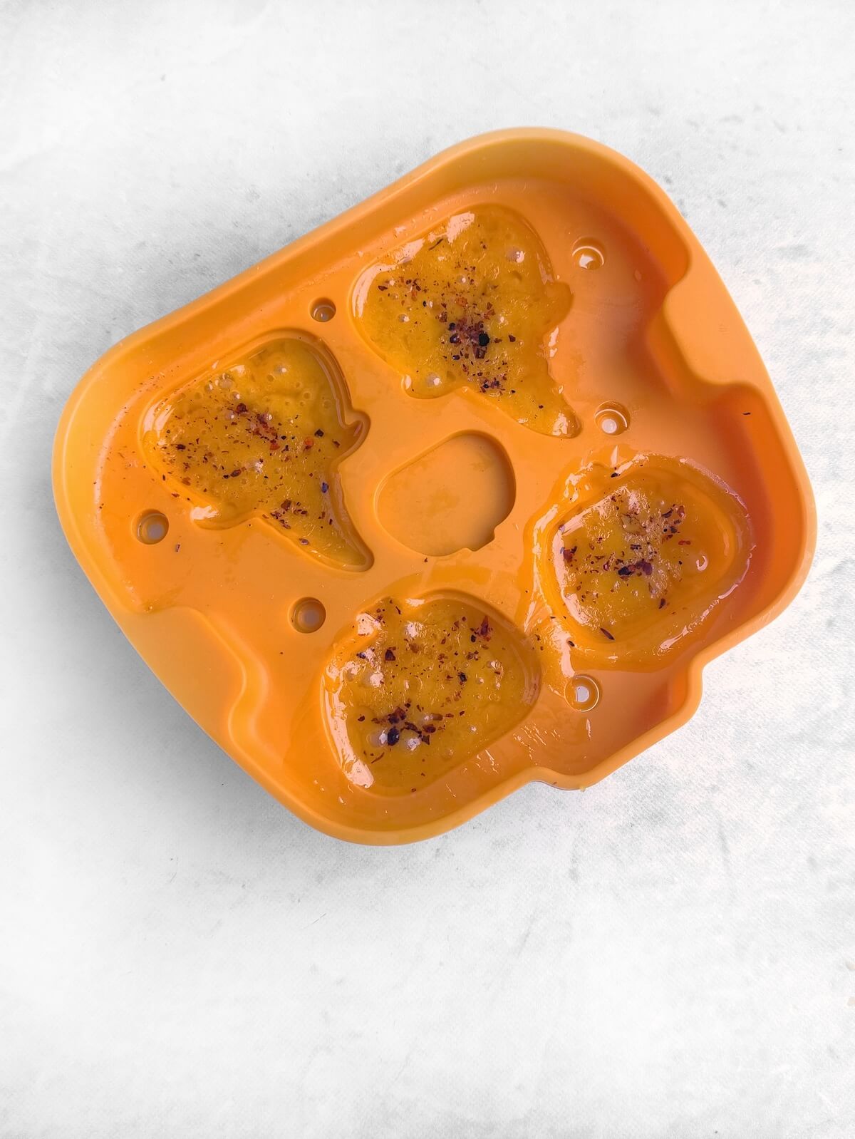 Jack-o’-Lantern Halloween Cheese Shapes 4 melted cheese in halloween silicone mould.