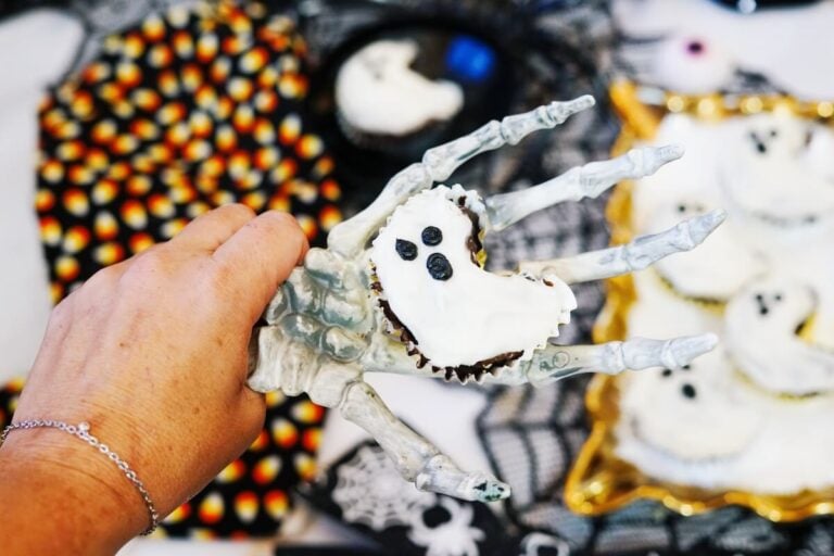 ghost cupcake on skeleton hand.