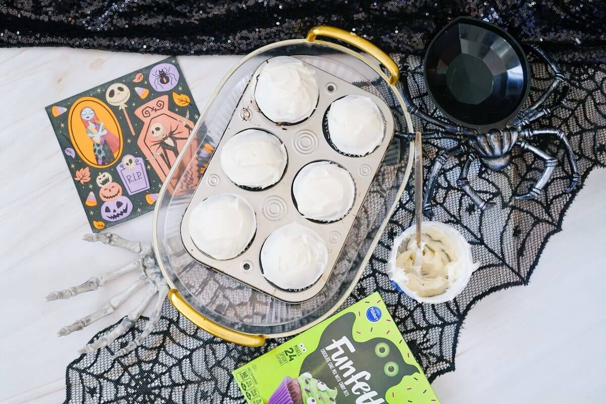 Jack Skellington Cupcakes: Quick Halloween Treat 2 white cupcakes ready for decorating.