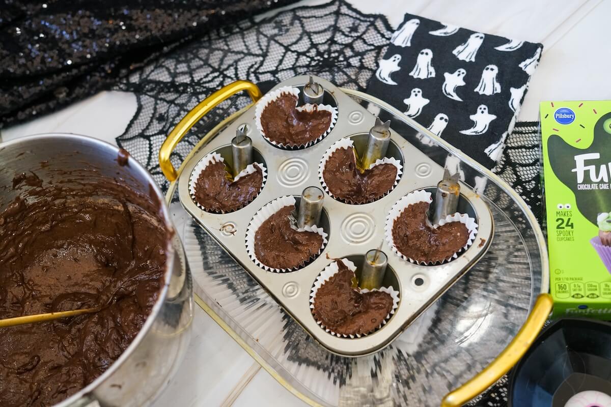 Easy Ghost Cupcakes 3 ghost shaped cupcakes.
